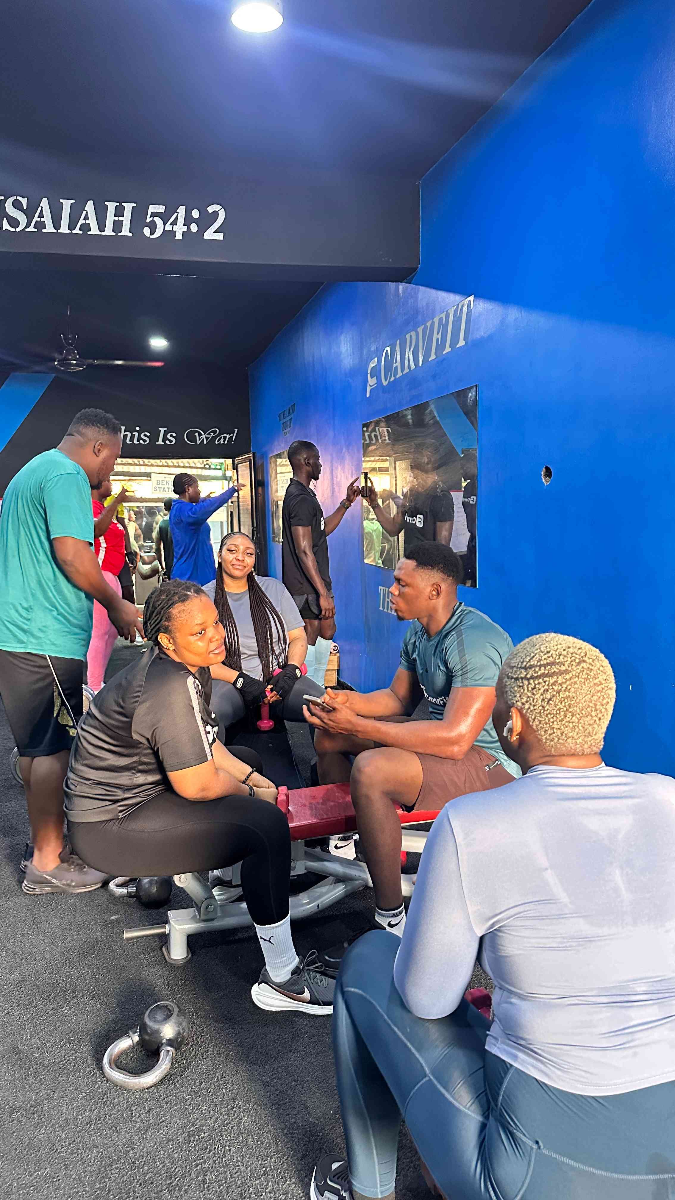 Carvfit members resting inside the gym after training